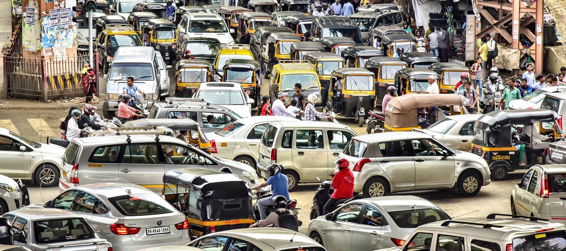 A street packed with cars and taxis